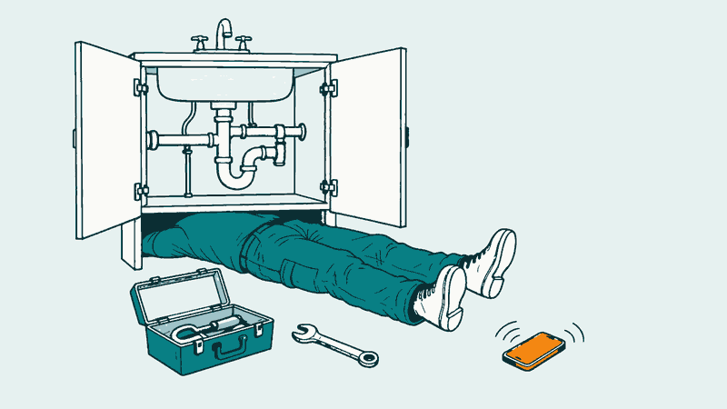 Drawing of a plumber lying under a sink, legs sticking out, while a phone rings on the floor out of reach.
